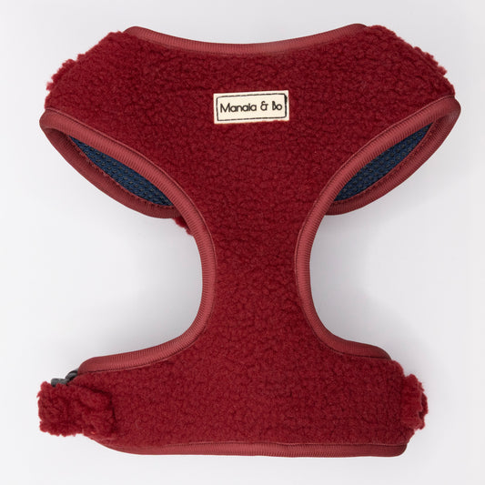 The Bordeaux Teddy Dog Harness is a red, fleece-lined, comfy pet harness for small to medium dogs, featuring a "Manala & bo" label on the front and shown against a plain white background.