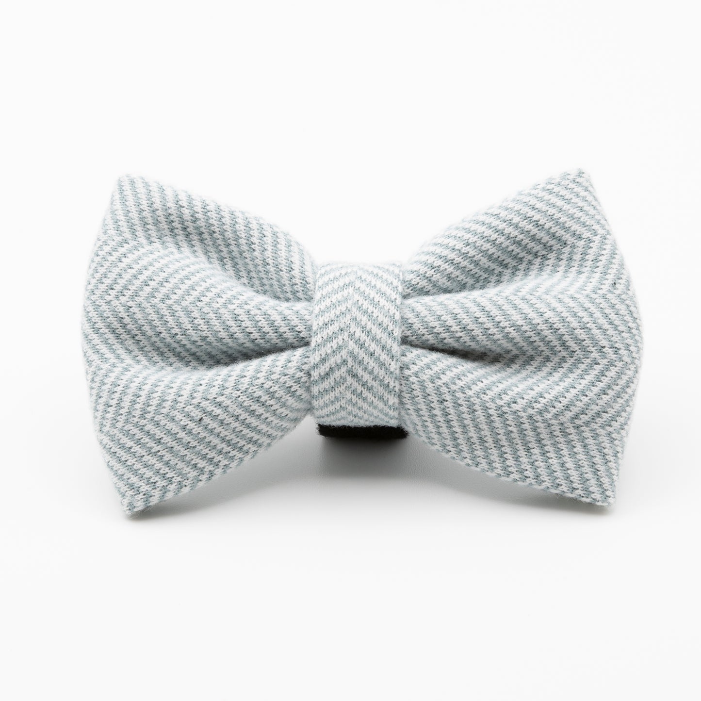 The Sky Tweed Dog Bow Tie features a light gray color with a subtle diagonal herringbone pattern—an elegant and stylish accessory for any dog.