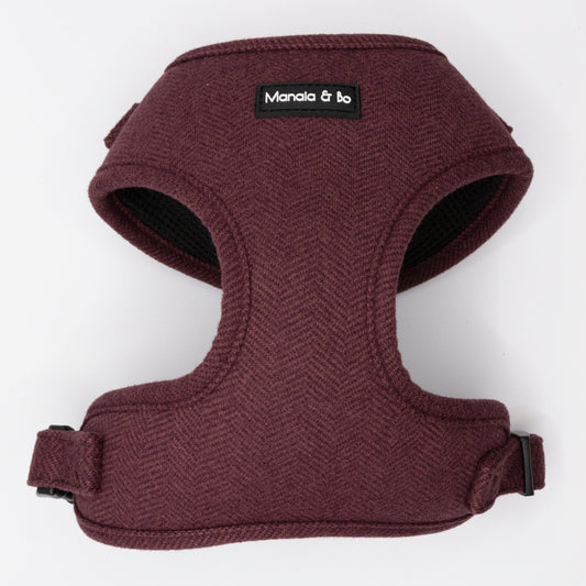 The Wild Plum Tweed Harness & Lead is a maroon adjustable harness with black trim for small to medium dogs. Featuring a "Manala & bo" black label on the front, it’s shown on a plain white background.