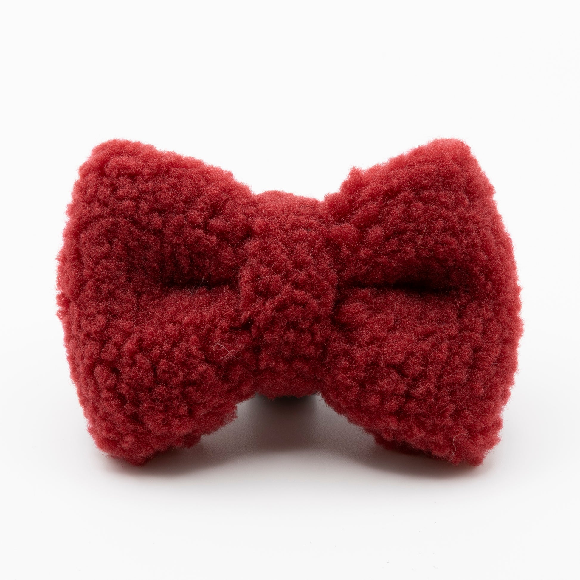 The Bordeaux Teddy Dog Bow Tie, made from soft textured red fabric, is shown on a plain white background—an elegant, adjustable accessory for your dog’s ultimate luxury look.