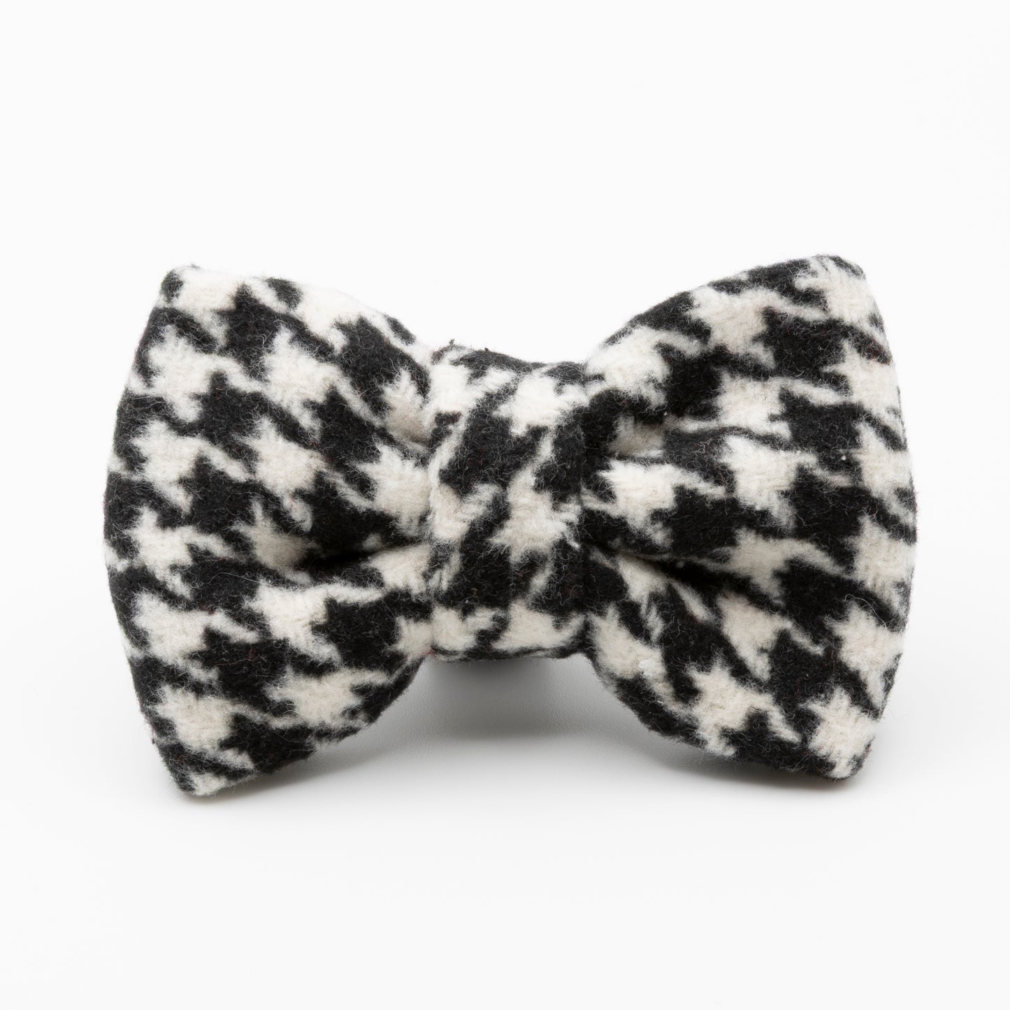 The Classic Houndstooth Dog Bow Tie features a soft, textured black and white fabric, shown against a plain white background.