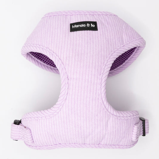 The Lavender Cord Harness & Lead features a light purple, ribbed harness with black plastic buckles and a Manala & Bo label on the front, shown on a white background. Perfectly pairs with the matching pastel purple lead.
