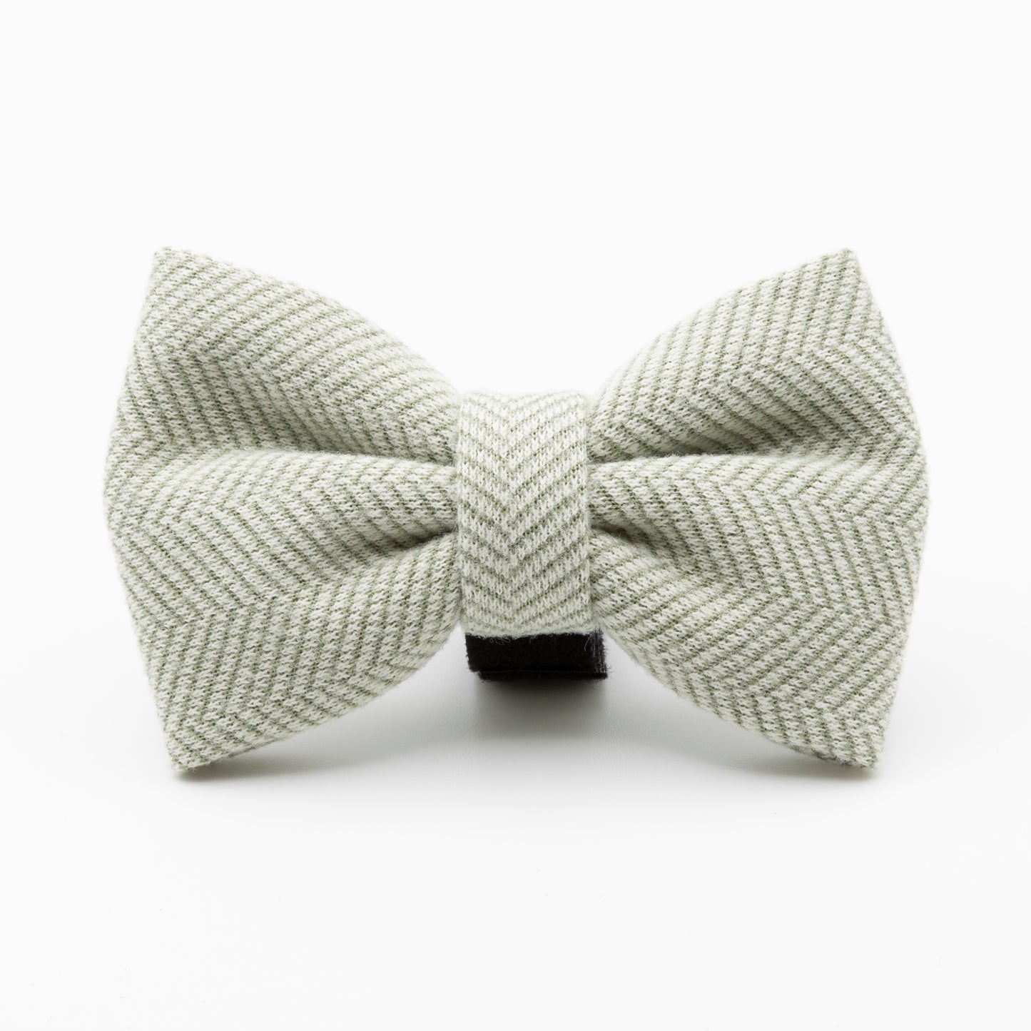 The Pine Tweed Dog Bow Tie features a light grey herringbone pattern and central knot, making it a stylish accessory for your dog. Displayed against a plain white background.