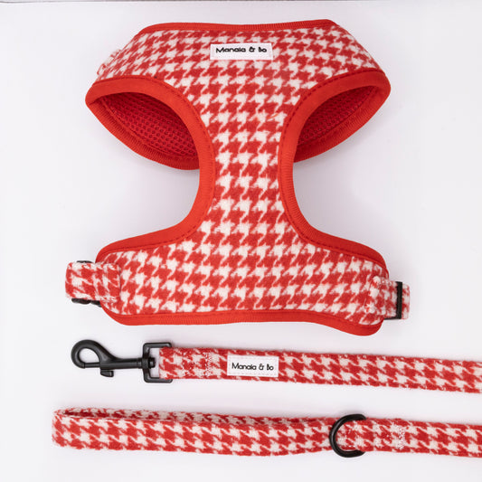 The Scarlet Houndstooth Harness & Lead, featuring a red and white houndstooth pattern and Manolo & co. label, are shown on a white background.